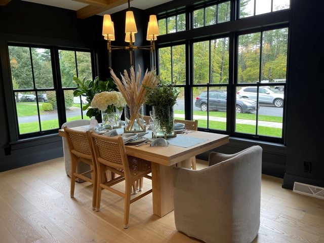 Wicker Furniture in Dark Dining Room, Julie & Co. Realty