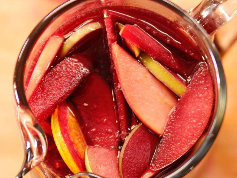 Fall sangria, shown in a top-down view of the drink in a pitcher 
