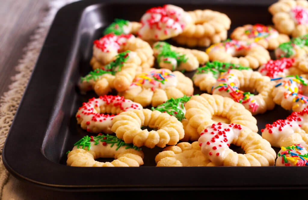 Spritz cookies on a baking sheet