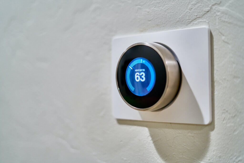 Smart thermostat on a white wall