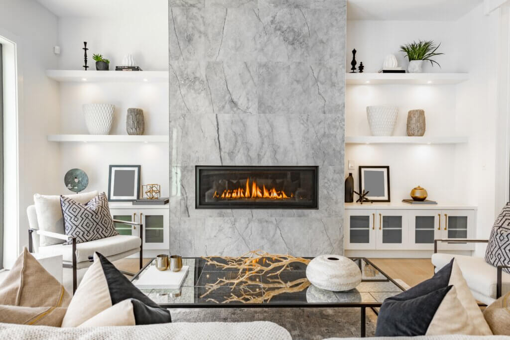 a minimalist marble fireplace with built-in